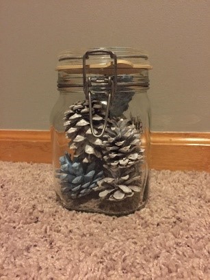 Display the pine cones - a mason jar or vase is a good option!