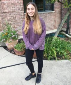 Carla poses outside her host family's home in Mokena, Il. 