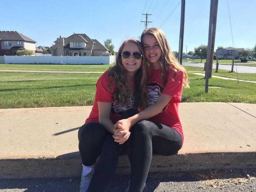 Elected Representatives Allie Twohig (left) and Emily Kuehl (right) representing Student Council at the Homecoming Parade