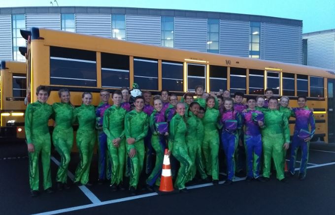 The Marching Bands Drill Team poses before the bus ride home