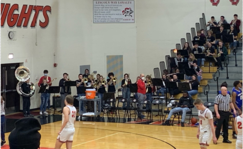 The LWC pep band plays at boys basketball Senior Night.