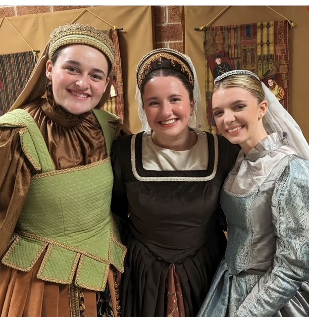 Madrigal participants smile after their performance.
