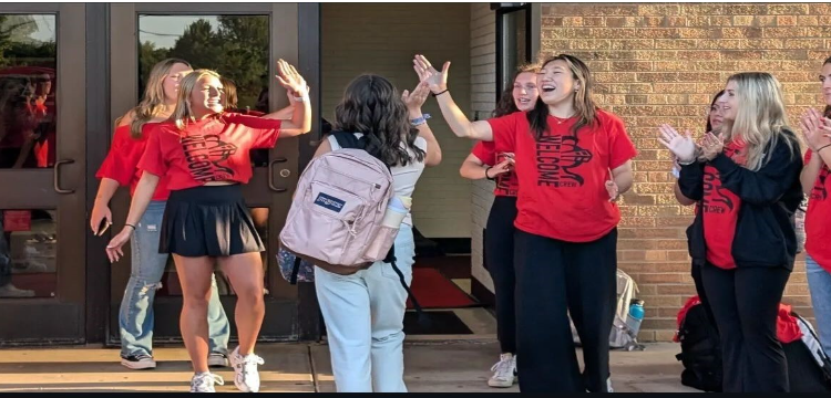 Link Crew greets students walking into the first day of school.