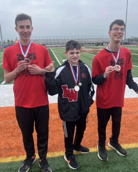 Cam Hancock, Colin Hurly and Seth Wheeler pose with their medals.