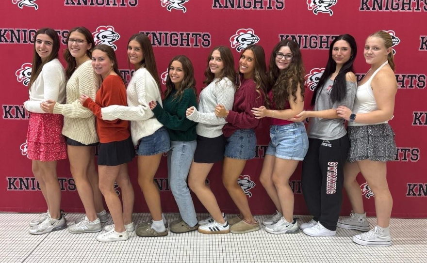 Senior swimmers pose after their Senior Night celebration.